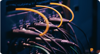 telecommunication network cables connected in server rack for data transmission